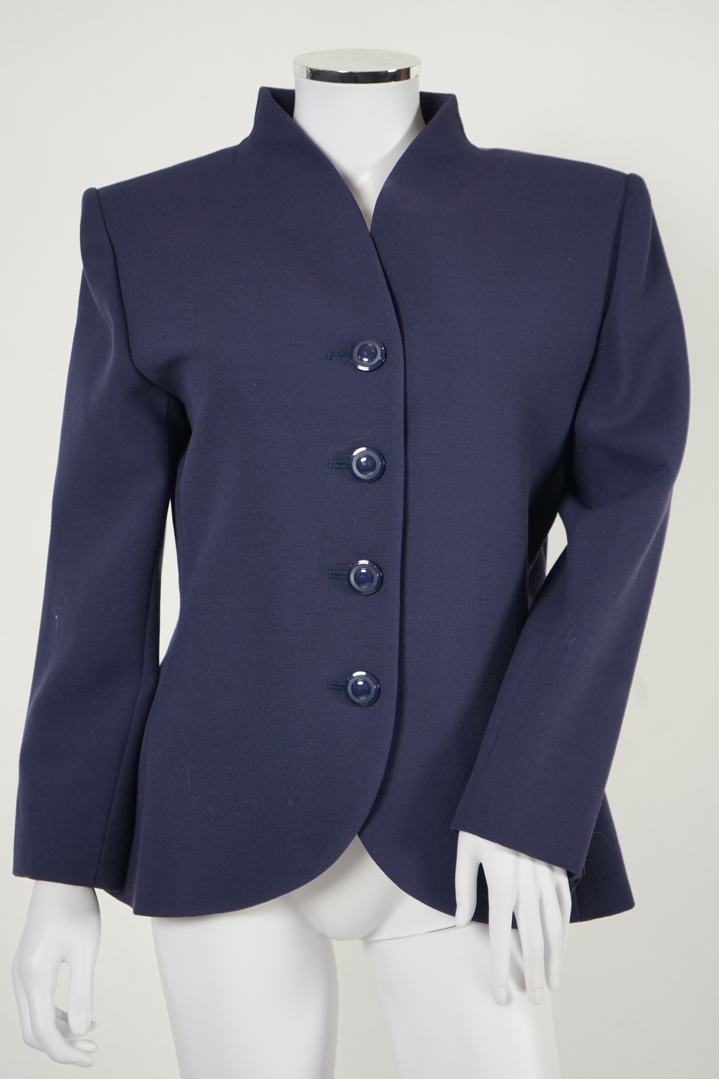 A vintage Yves Saint Laurent variation lady's navy wool skirt suit, F 42 (UK 14).Please note alterations to make the waist smaller may have been carried out on some of the skirts. Proceeds to Happy Paws Puppy Rescue.